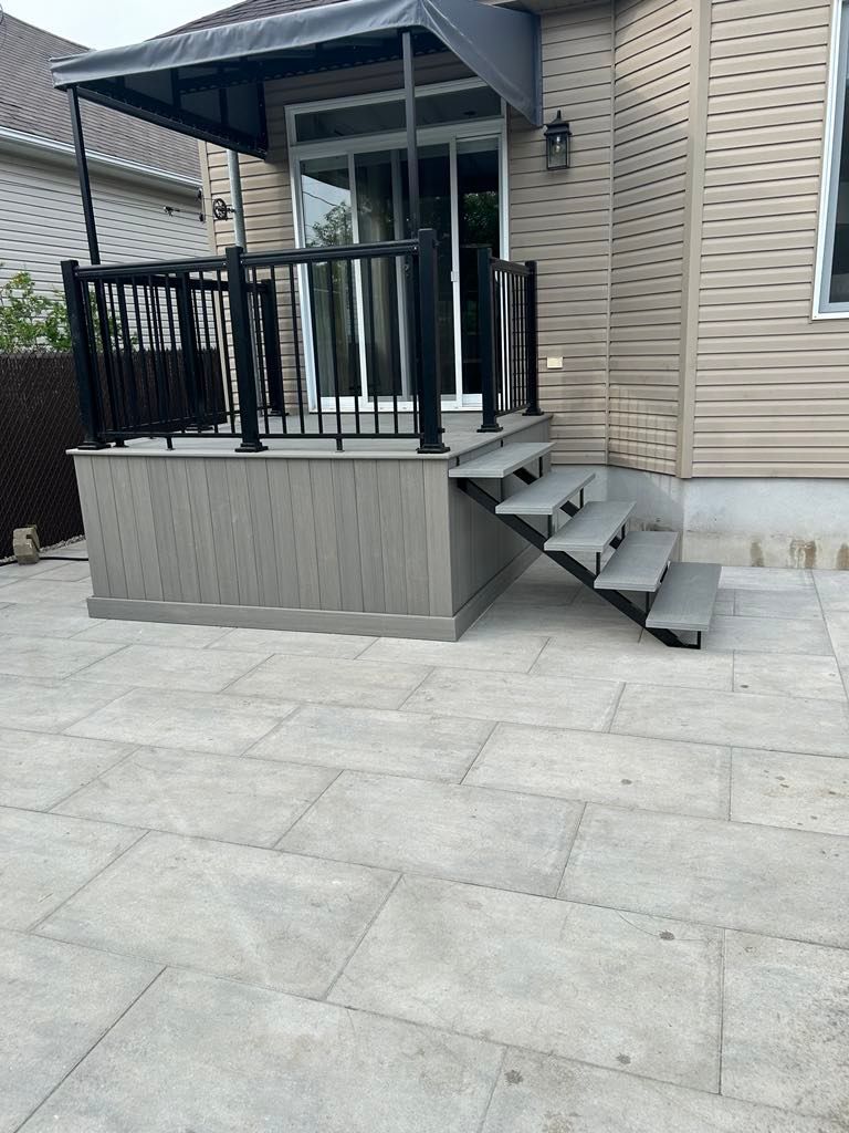 A deck with stairs leading up to it and a canopy over it