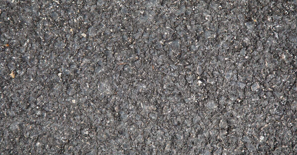 Asphalt and concrete parking surfaces compared side by side