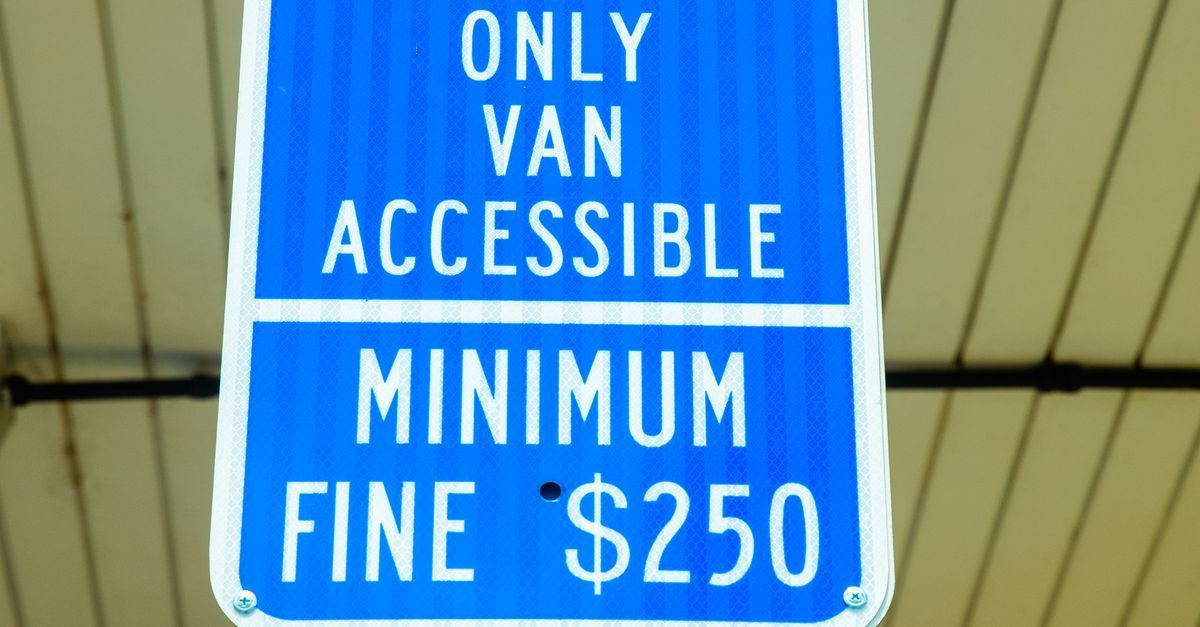 Accessible parking space with wheelchair symbol and ADA signage