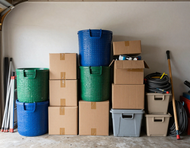 Cluttered garage before cabinets