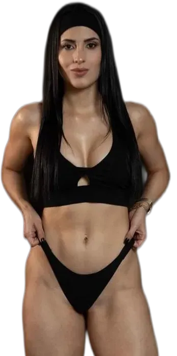 Woman in black bikini posing against a plain white background