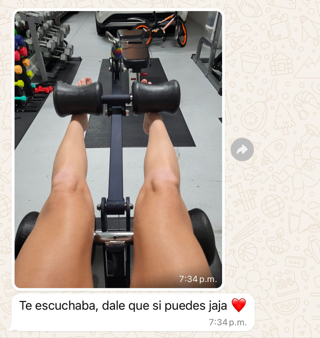 Person using a leg curl machine in a gym, with a phone caption at the bottom.
