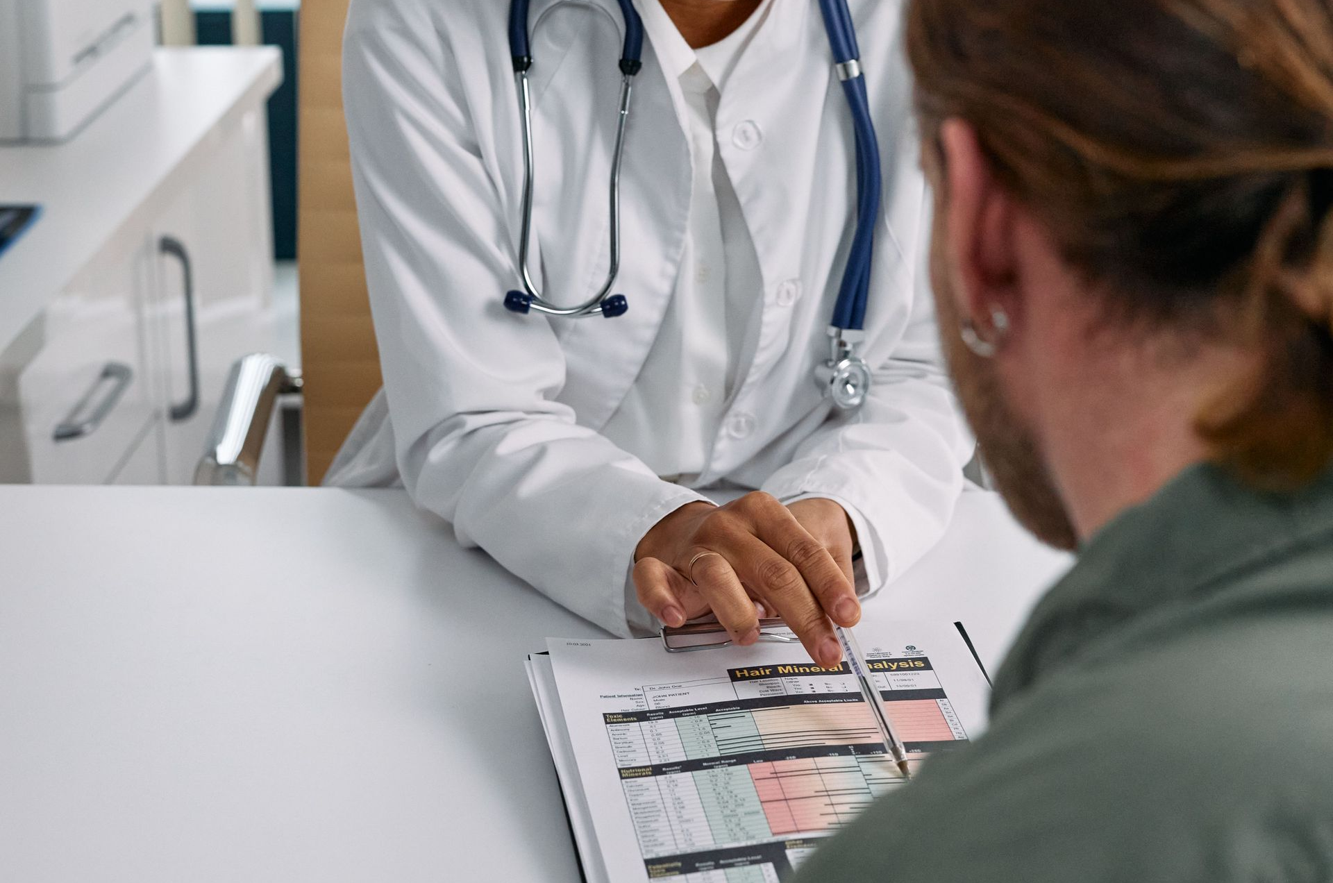 Doctor Reviewing Documents With Patient