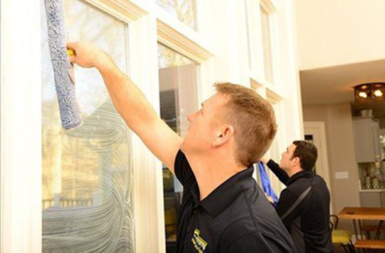 Cleaners Cleaning Window — Cedar Rapids, IA — Eastern Iowa Carpet Care Inc Cleaners Cleaning Window — Cedar Rapids, IA — Eastern Iowa Carpet Care Inc
