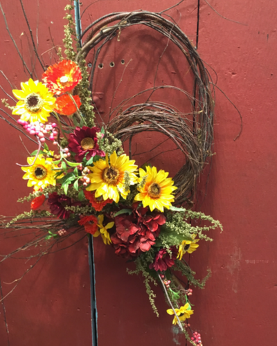 summer wreath with red and yellow flowers