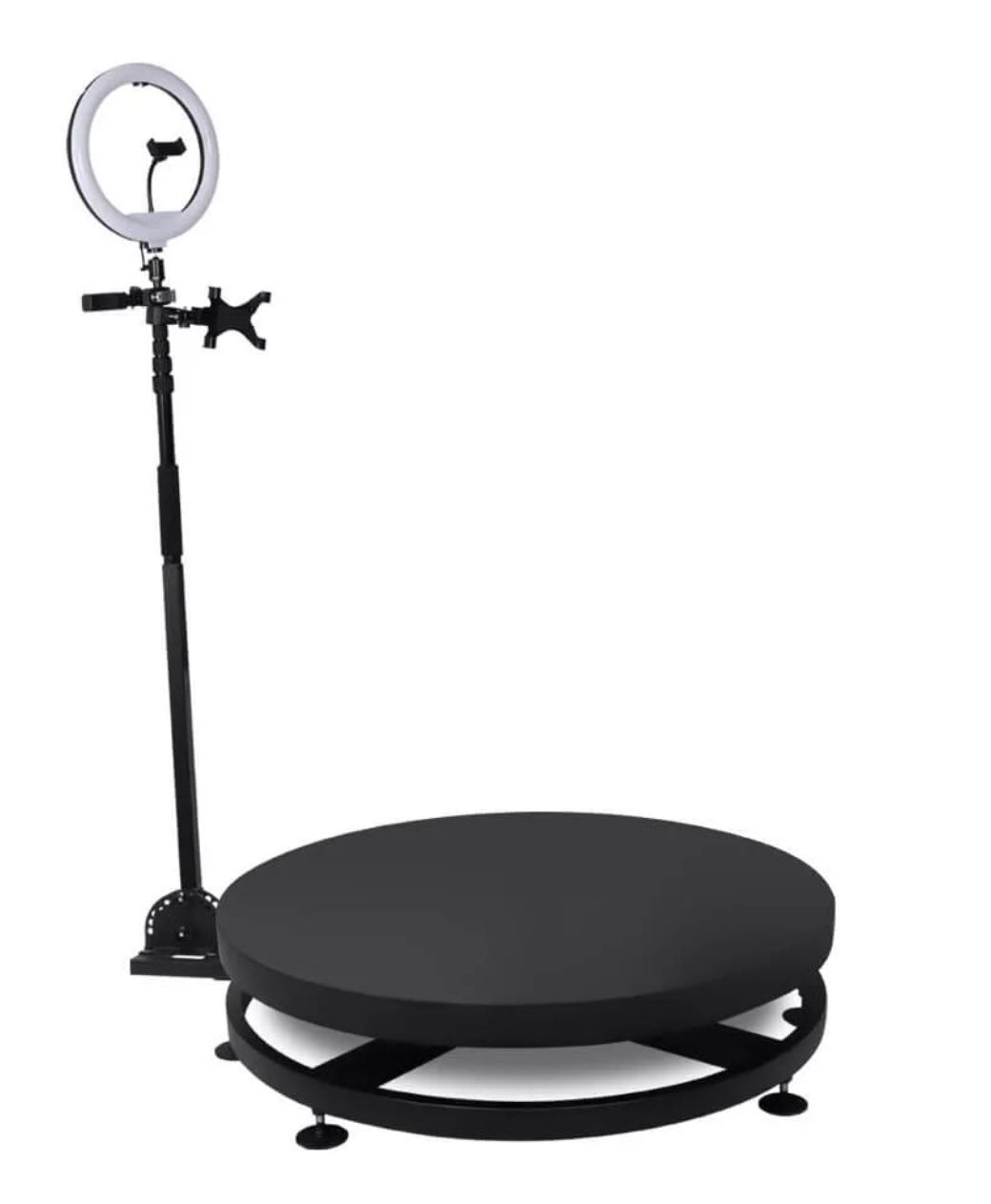 A black round table with a ring light attached to it.