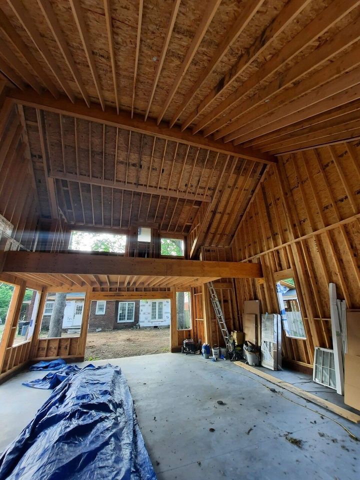 The inside of a building under construction with a lot of windows.