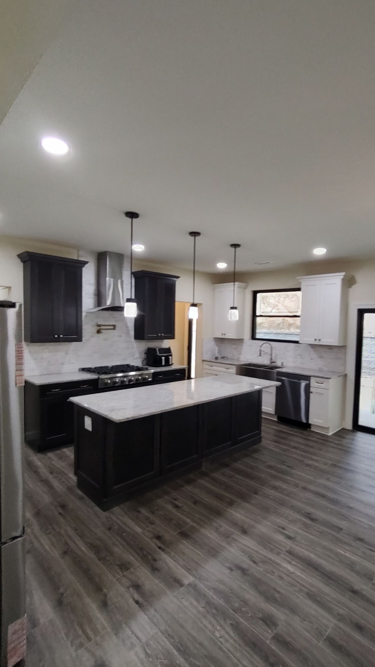 A kitchen with a large island in the middle of the room.