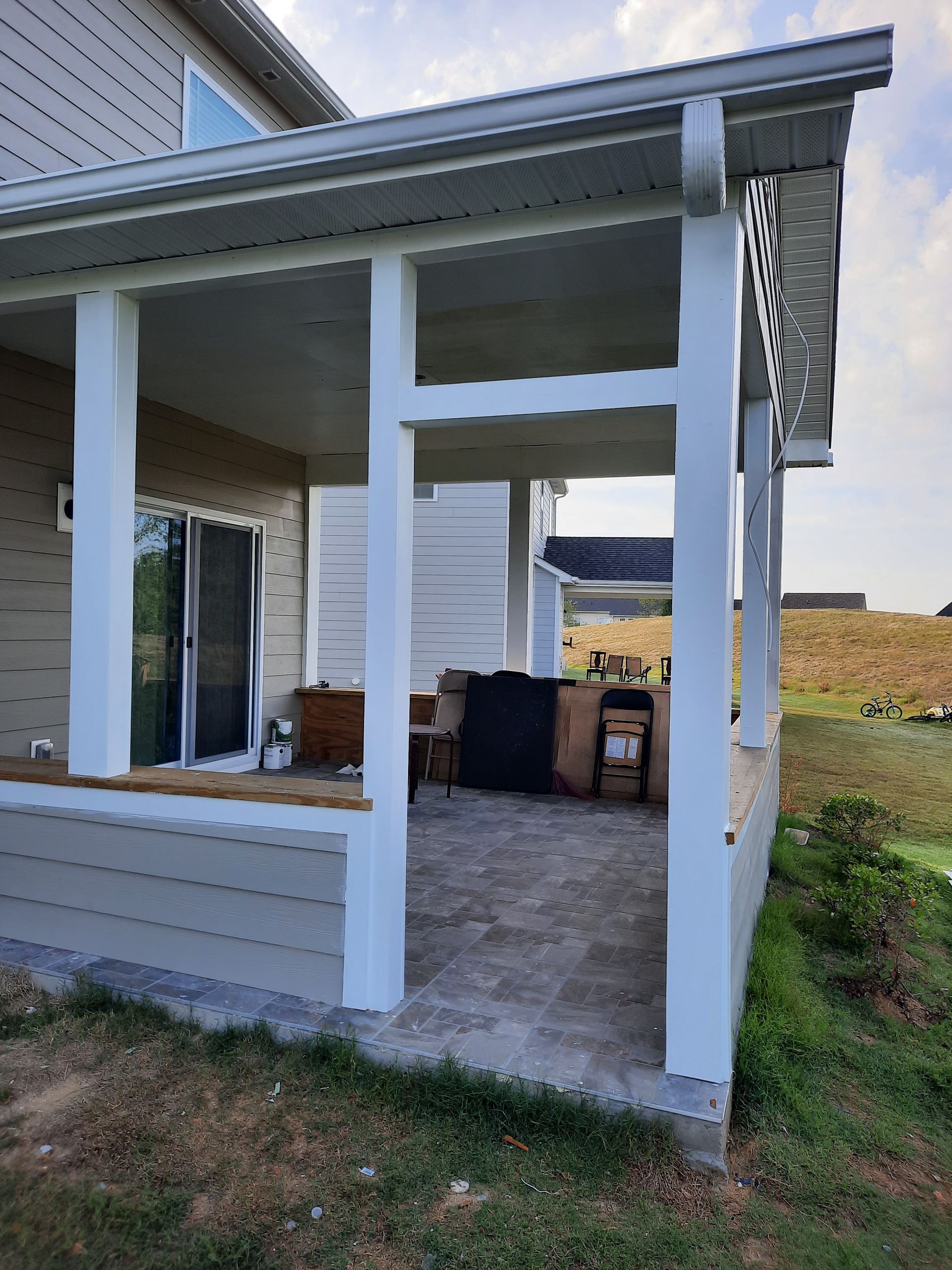 A house with a porch and a patio area