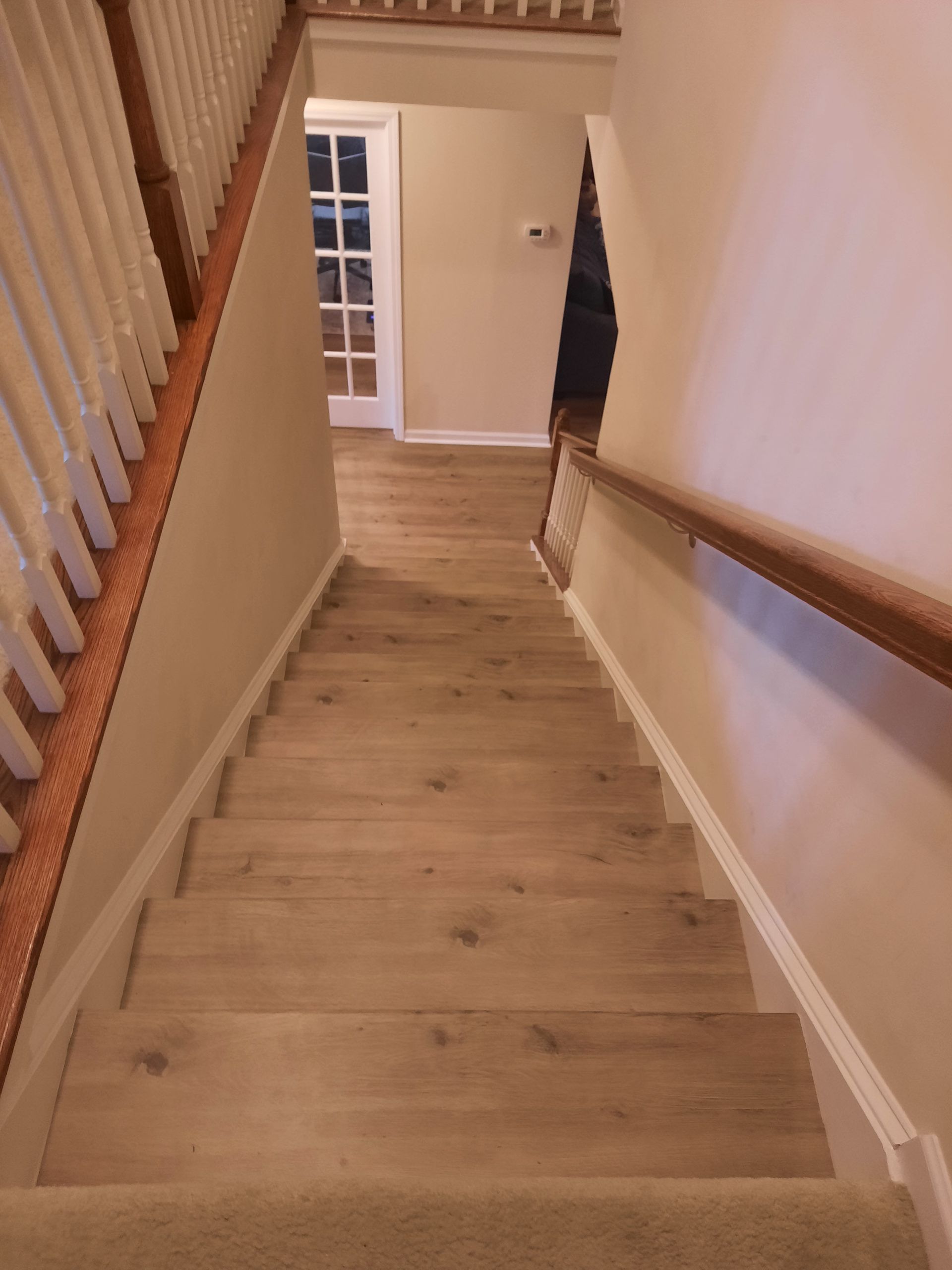 A set of stairs leading up to a second floor in a house.