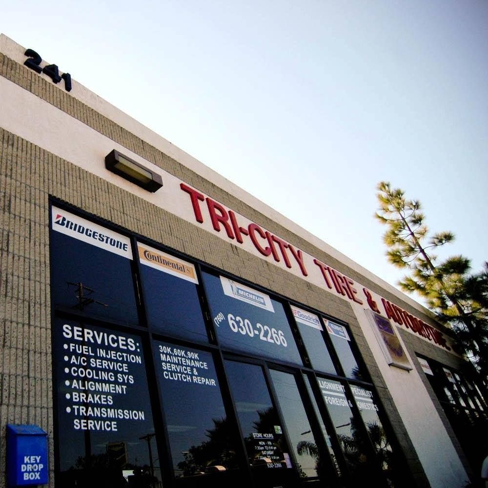 Tri-City Tire & Automotive shop front with services listed and phone number.
