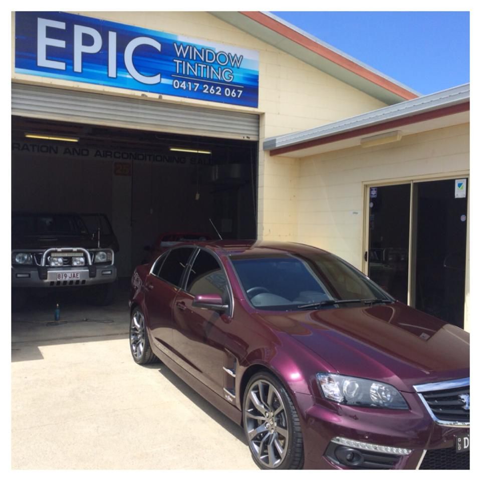 A Purple Car Is Parked in Front of A Building that Says Epic Window Tinting — Epic Window Tinting in Mackay, QLD