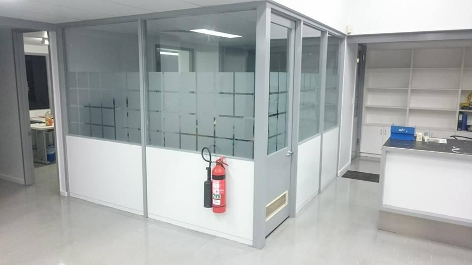 A Room with A Fire Extinguisher Hanging on The Wall — Epic Window Tinting in Glenella, QLD