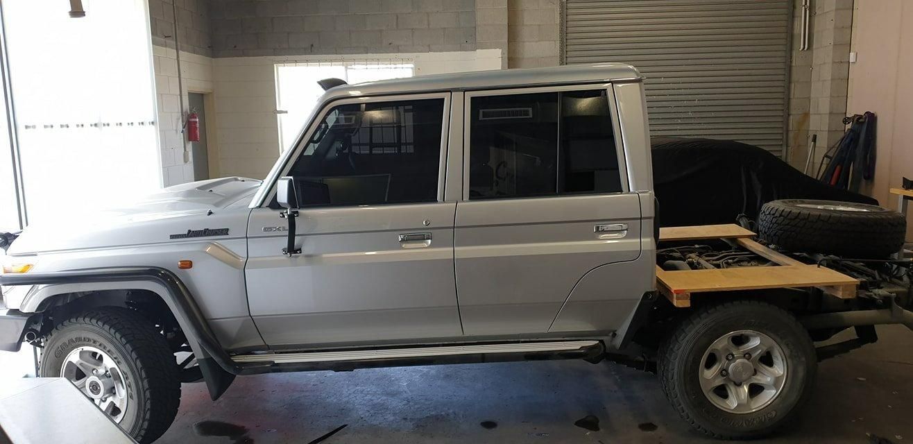 A Silver Pickup Truck Is Parked in A Garage — Epic Window Tinting in Sarina, QLD