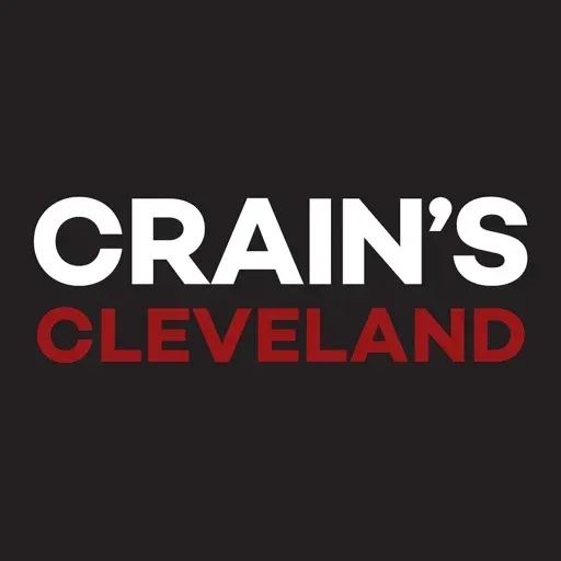 A logo for crain 's cleveland on a black background
