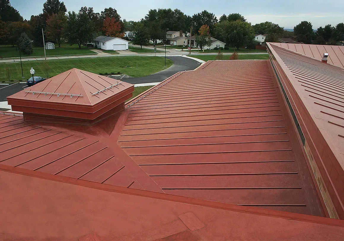 The roof of a building with a red roof