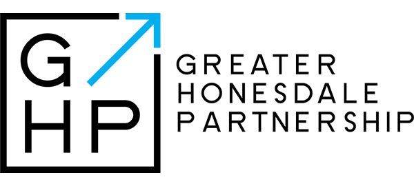 Greater Homesdale Partnership logo with black letters and a blue upward arrow