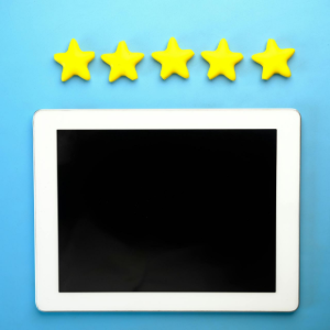 Five yellow stars above a blank tablet screen on a blue background
