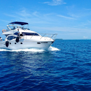 Luxury white yacht cruising on deep blue ocean under a clear sky