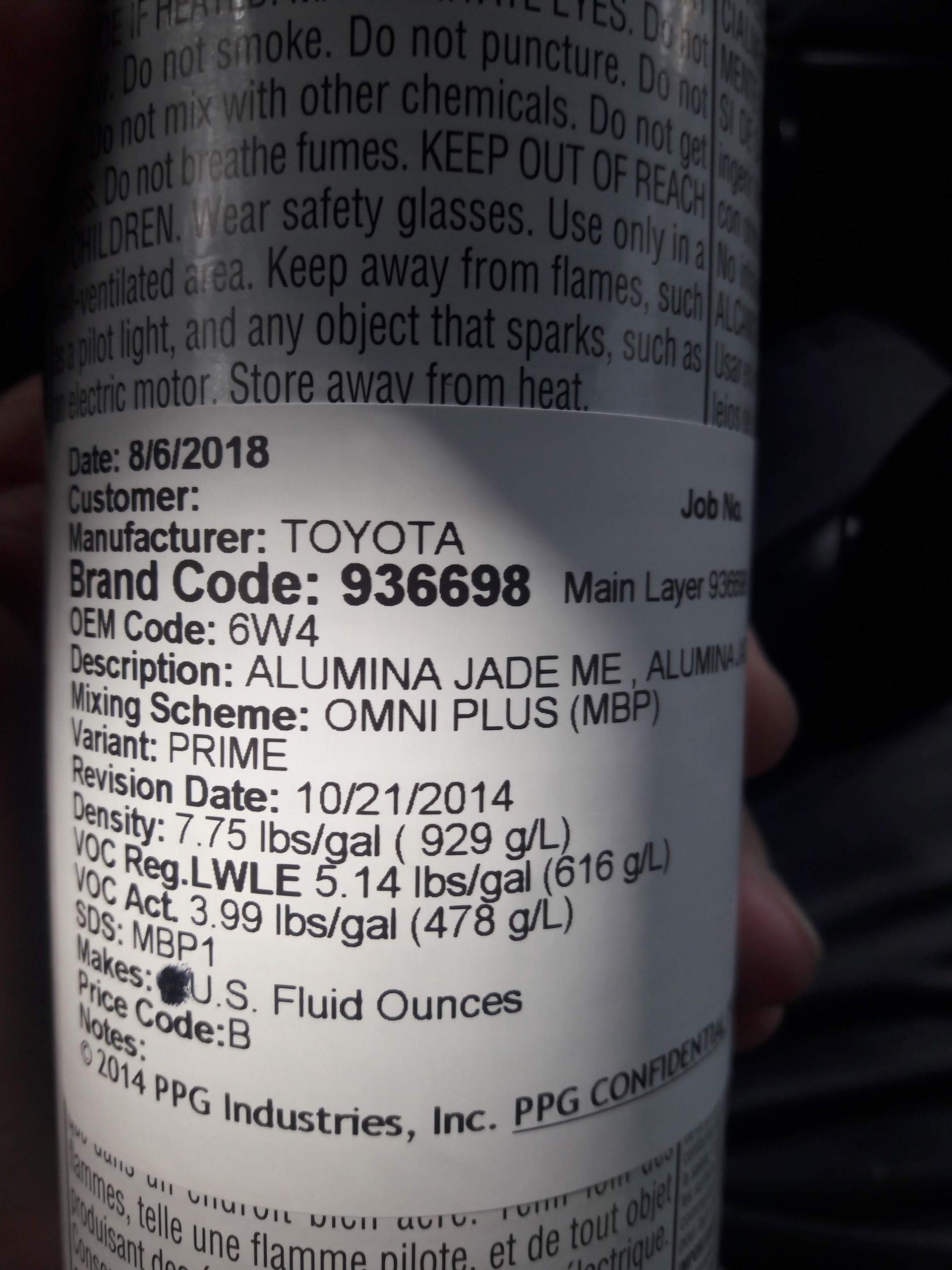 Close-up of a Toyota ATF Type T-IV fluid label on a bottle, with printed specifications visible.