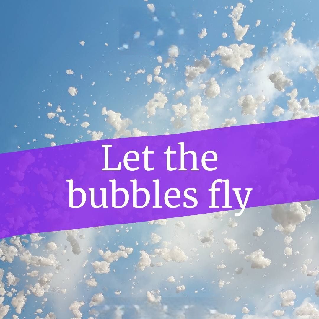 A purple sign that says let the bubbles fly