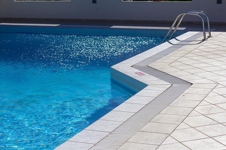 a deck finish beside a pool