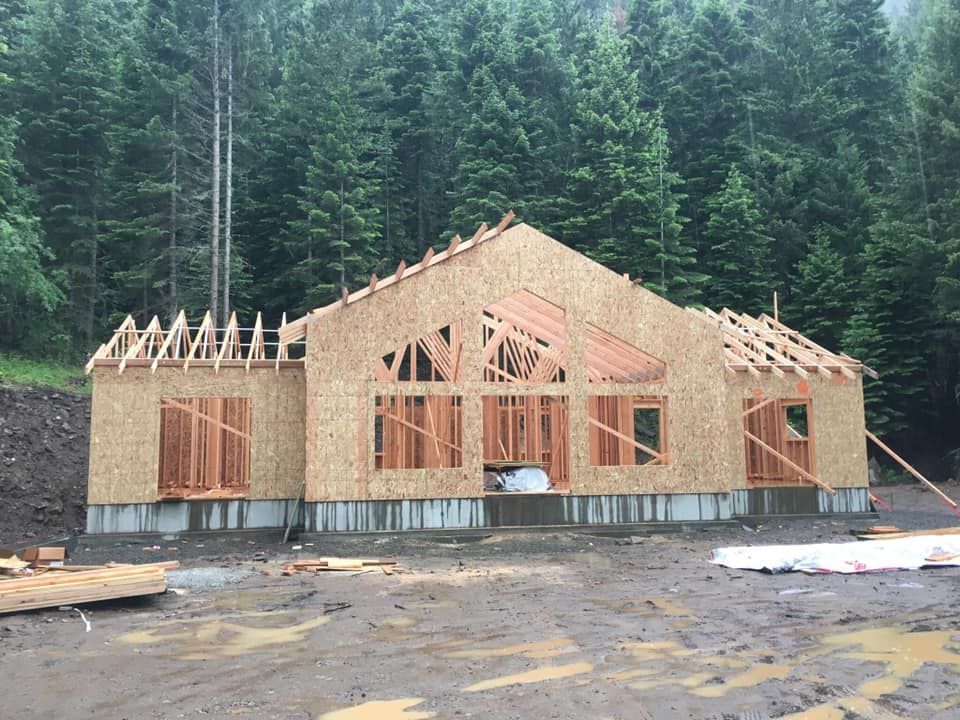 A house is being built in the middle of a forest.