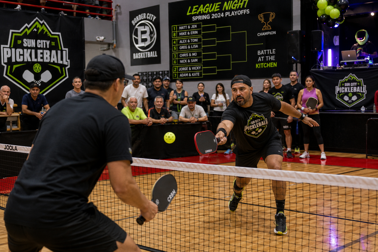 League-night pickleball rally at Sun City Pickleball Club with spectators and a tournament