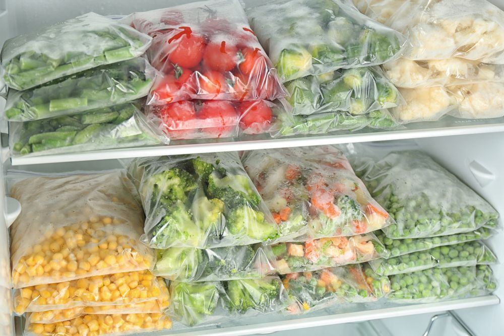 Freezer Shelves Filled with Clear Bags of Frozen Vegetables — Lakeside Gas Fridges In Maitland, NSW