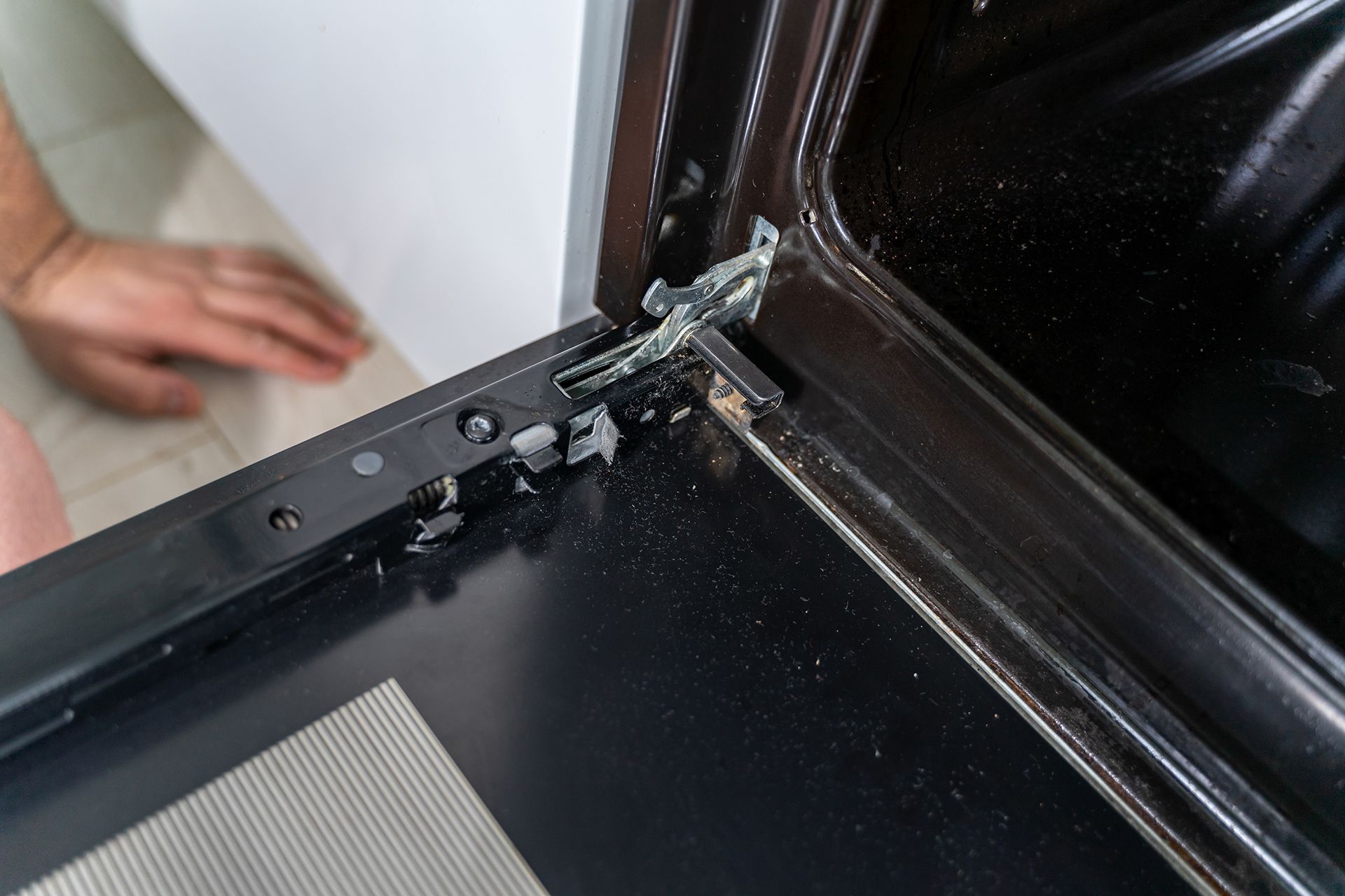Broken Oven Door Hinge with Shattered Glass — Lakeside Gas Fridges In Lake Macquarie, NSW