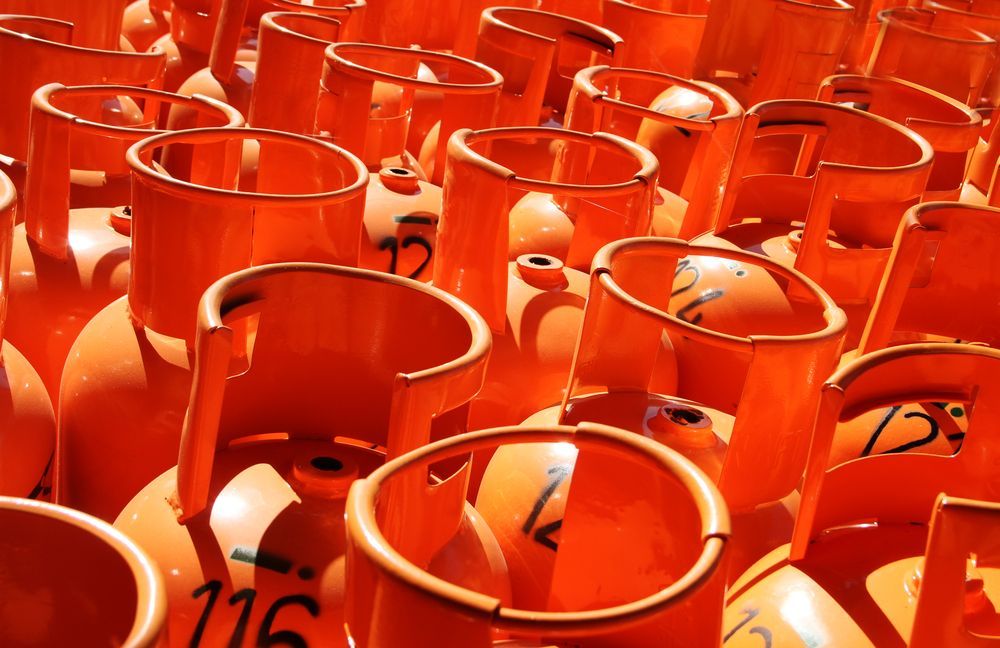 Orange Propane Tanks Stacked Together — Lakeside Gas Fridges In Argenton, NSW