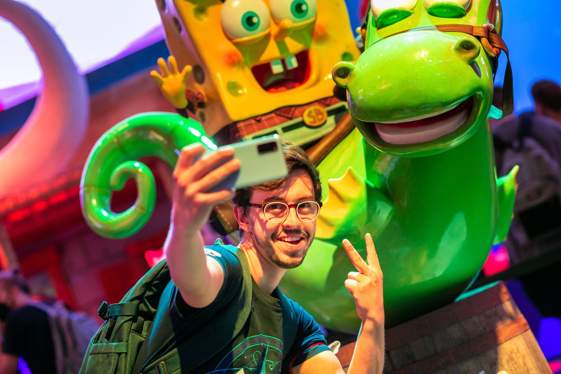 The THQ Nordic booth Gamescom, designed and built by Evolve. This detail shows a visitor taking a selfie.