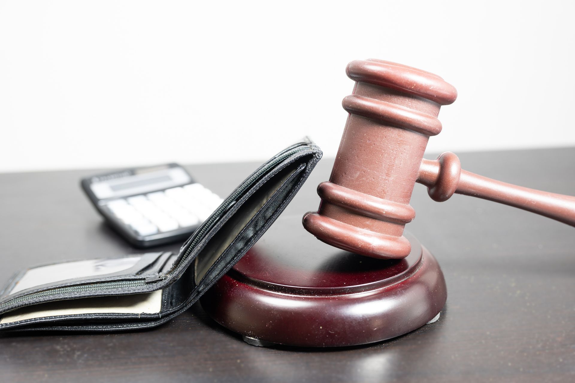 Judge's gavel with an empty wallet. Judge's gavel with an empty wallet.