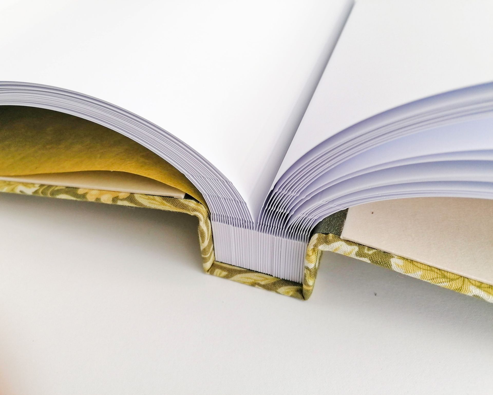 The image shows the album opened on the table and parted in the centre so that the pages are spread equally.