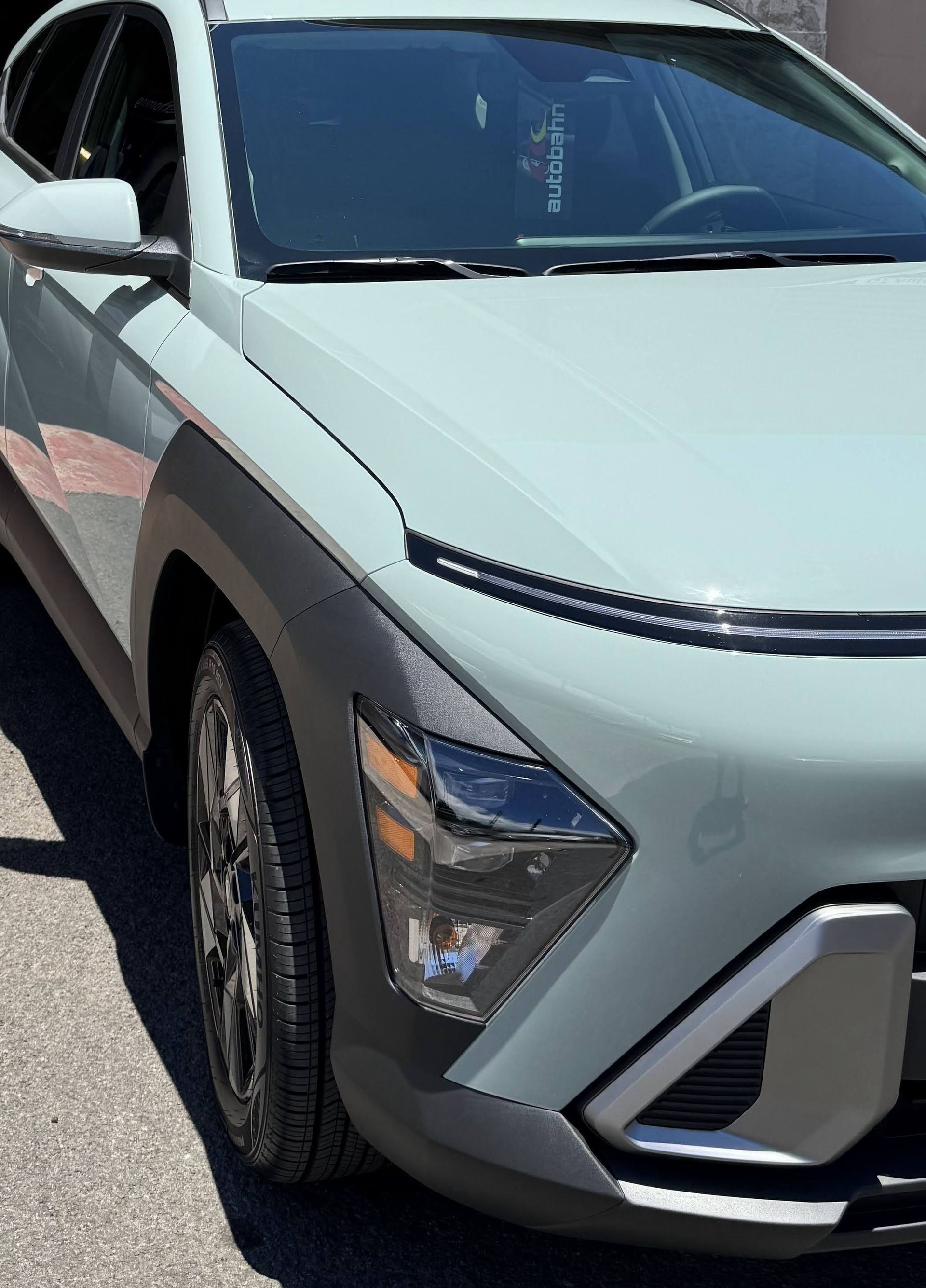 Silver SUV parked outdoors, front-left view with black trim and angular headlights