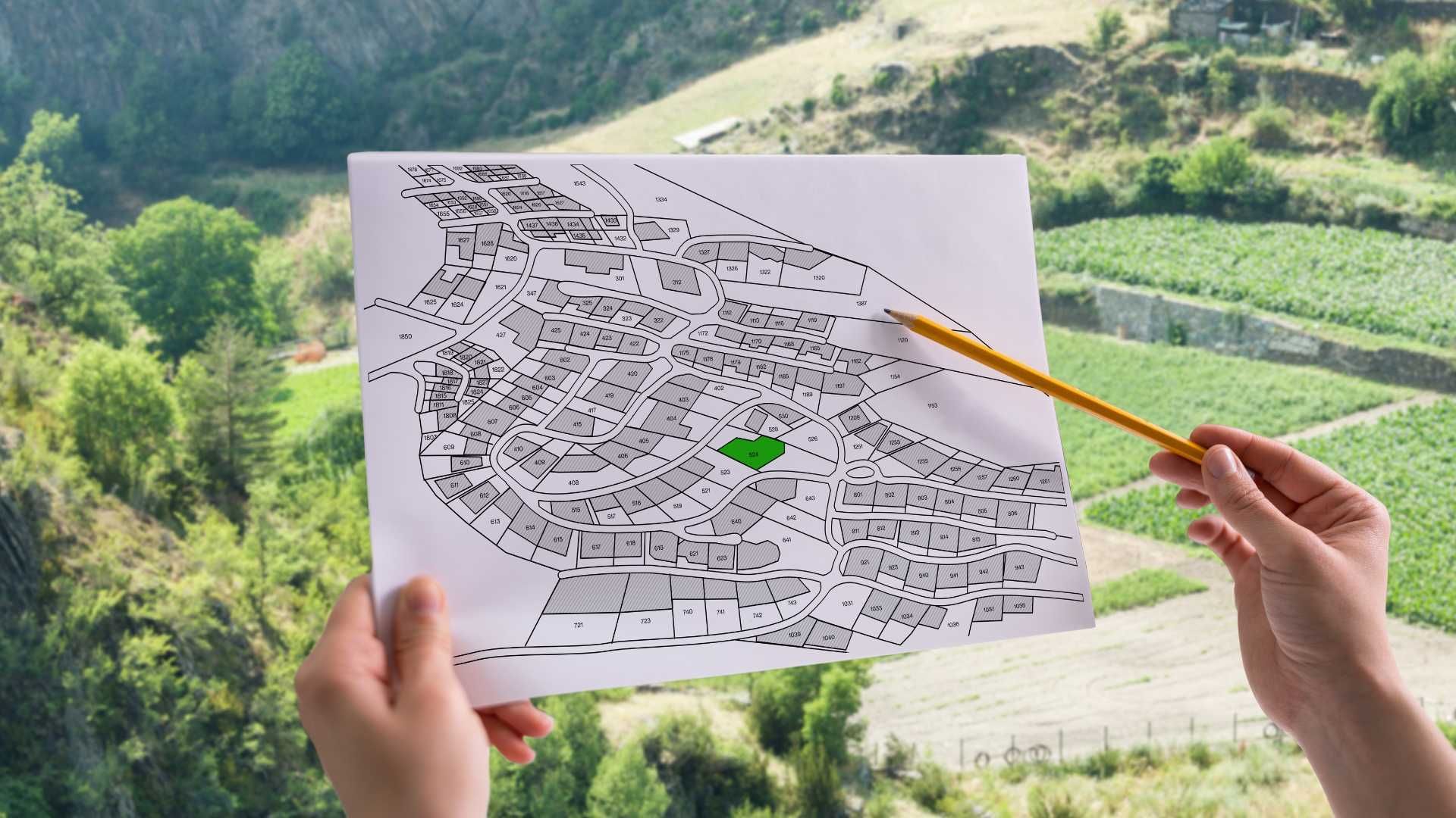 A person is holding a piece of paper with a drawing of a bird on it.