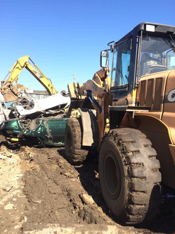 A bulldozer with the letter c on the side of it