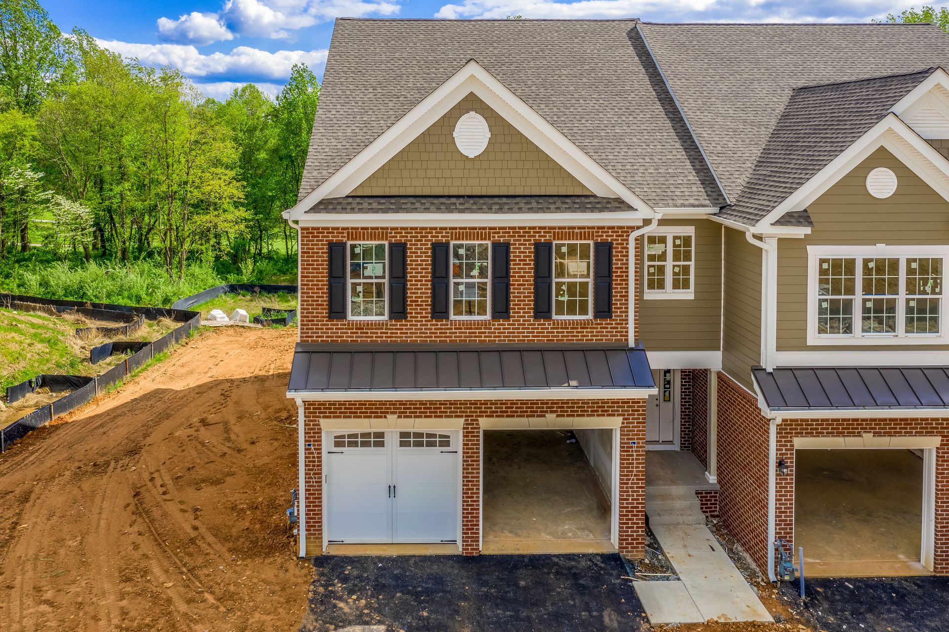 An aerial view of a house under construction with a garage.