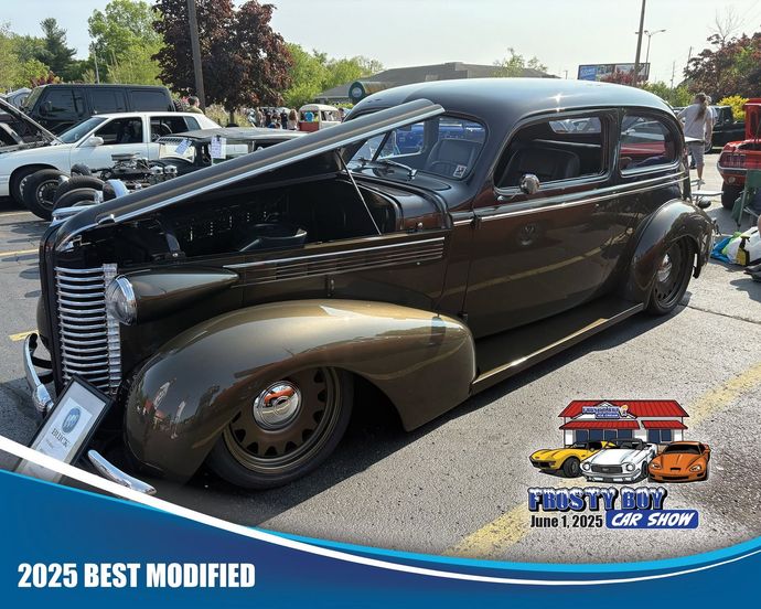 Black vintage hot rod with hood open at an outdoor car show, labeled “2025 Best Modified”