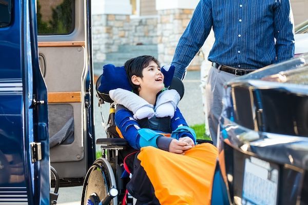 Young boy in a wheelchair, smiling