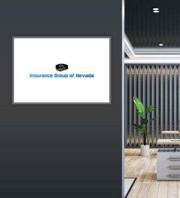 Framed logo for Insurance Group of Nevada on dark wall next to a modern office.