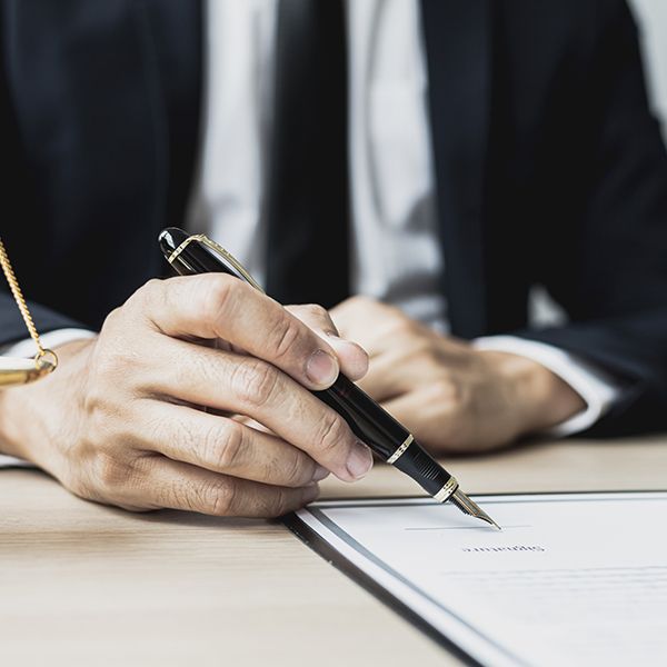 Man signing a document