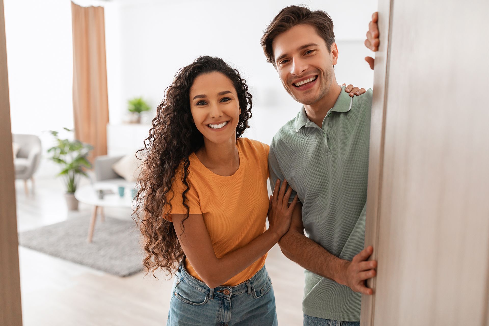 Couple Opening the House Door