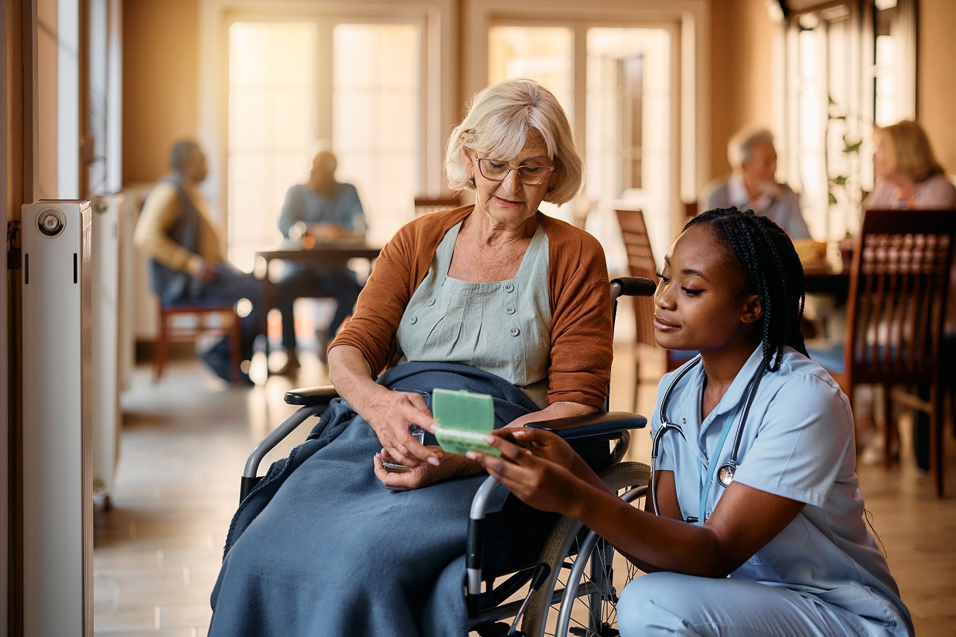 Senior Woman on Wheelchair With Her Nurse