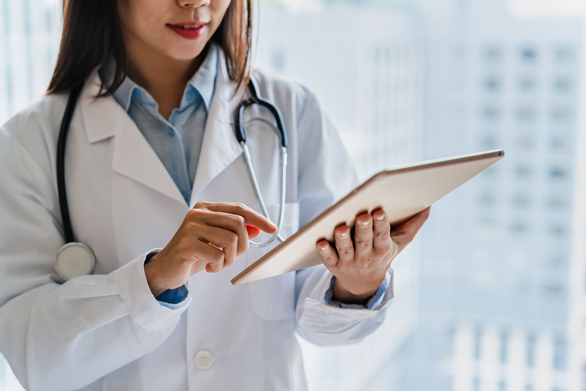 Physician Checking Her Tablet