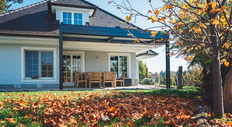 a house with a patio with a table and chairs on it
