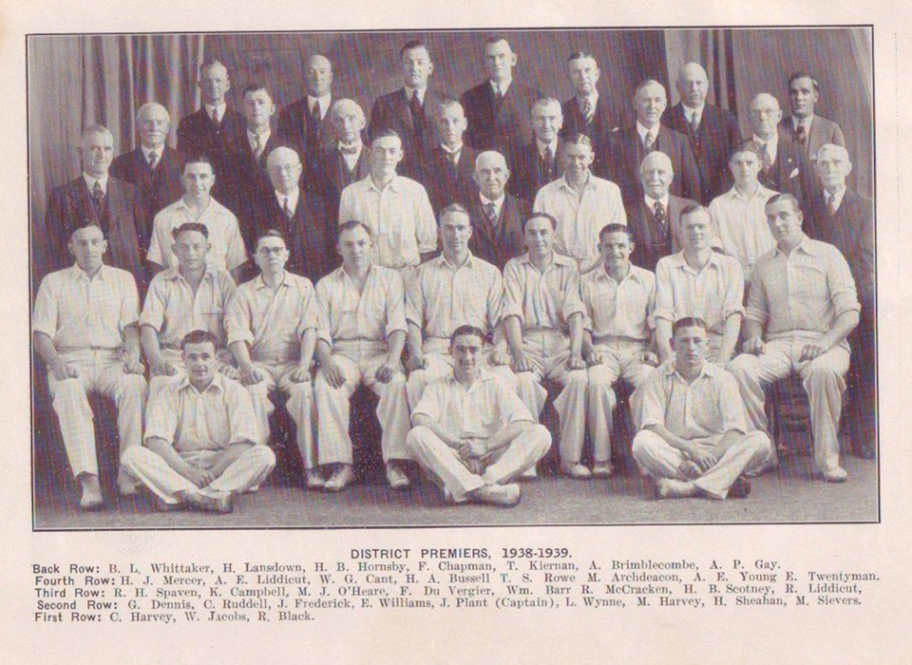 Group portrait of 24 men posing in two rows for an official team or staff photo.