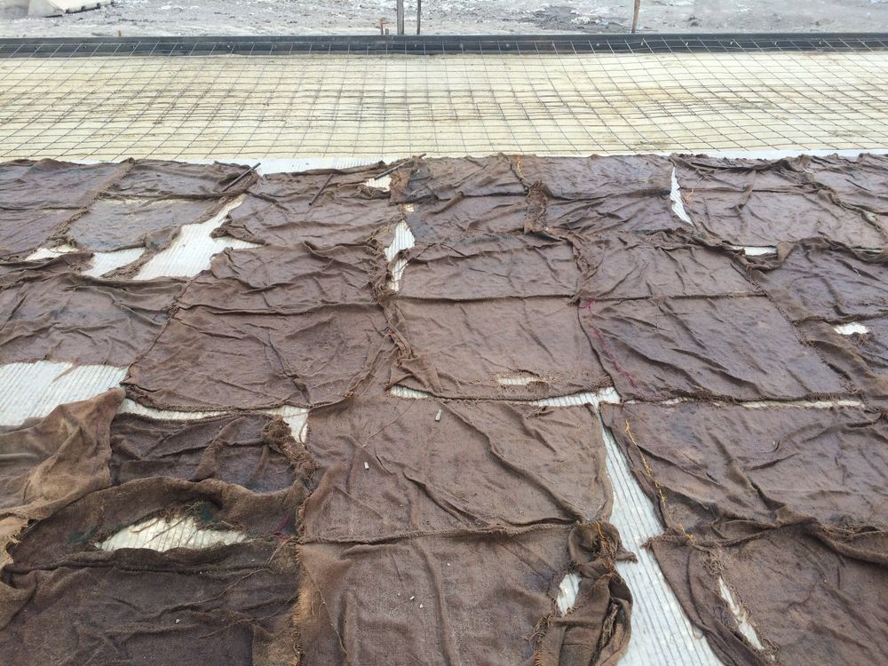 blankets on top of curing concrete.