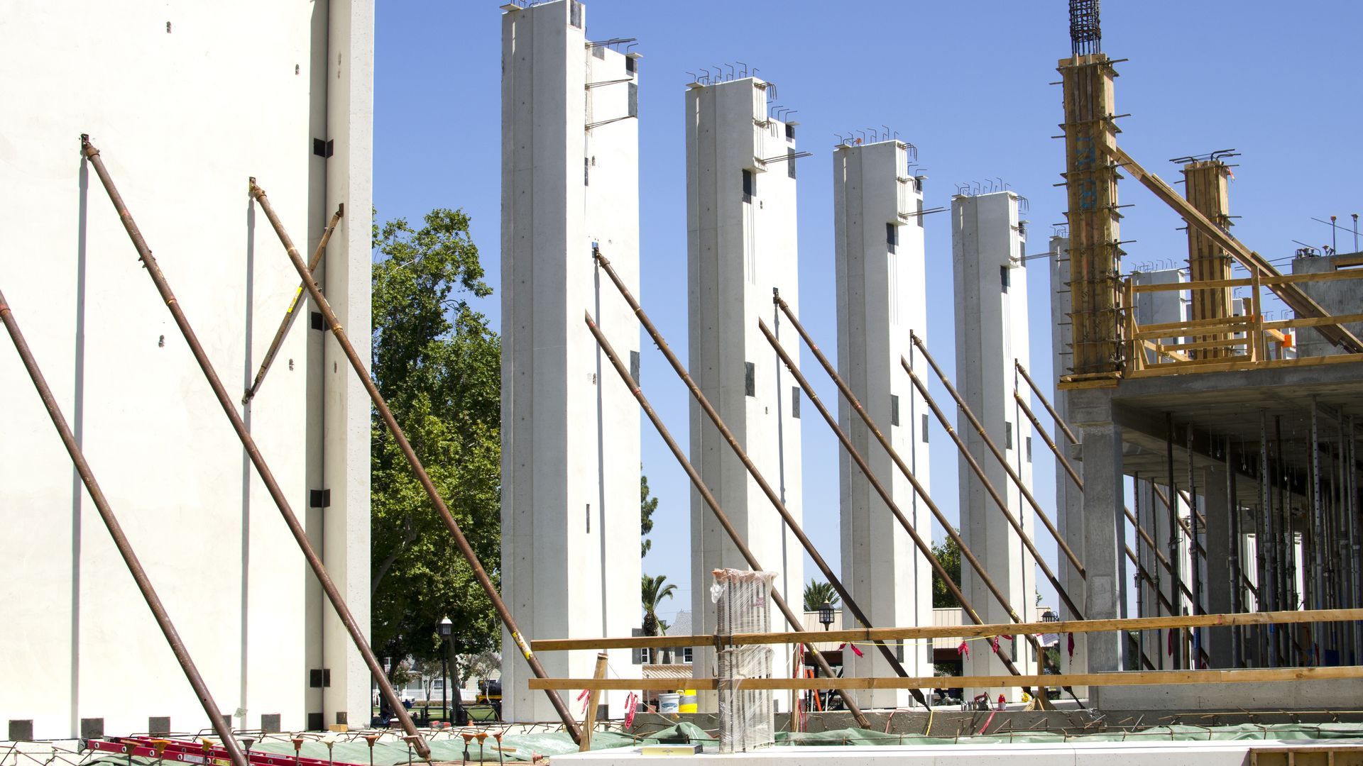 Concrete wall braces on a worksite.