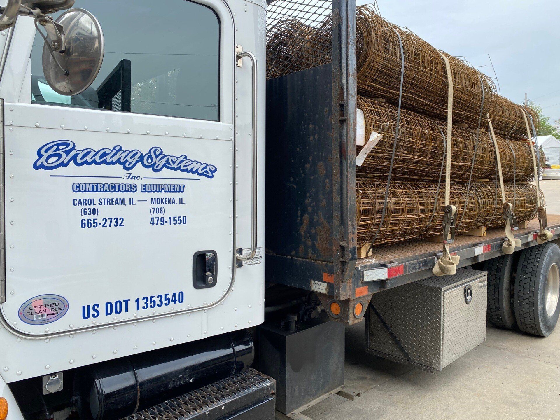 Bracing Systems delivery truck transporting rolled concrete reinforcement mesh to a construction jobsite